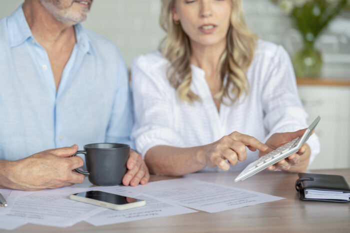 mature couple avoiding mortgage stress through budgeting techniques