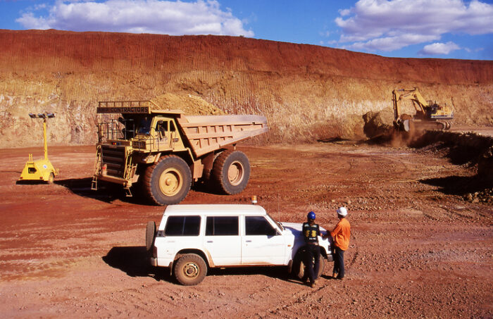 Tanami Desert, Northern Territory, Australia, May 20, 1995: View of open cut gold mine pit and workers in the red soil Tanami desert.