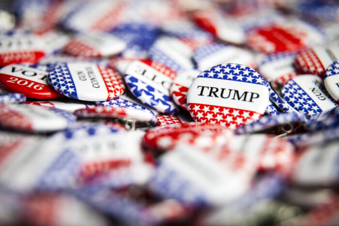 Close up of Vote election buttons, with red, white, blue and stars and stripes. Donald Trump is the republican candidate for president in the United States