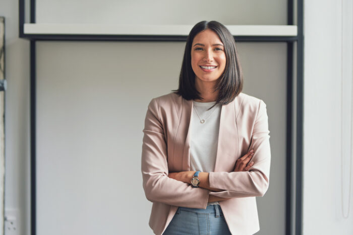 Portrait of business woman after calculating gross and net rental yield