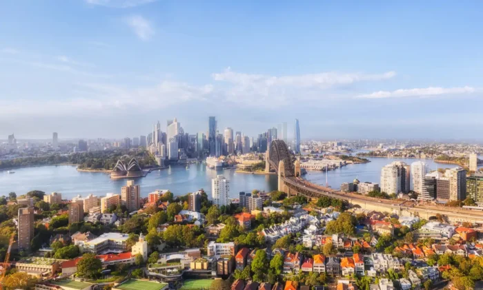 Sydney CBD drone shot over wealthy residential suburb